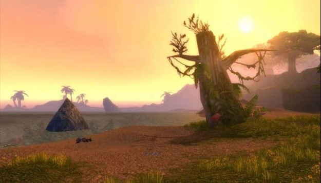 A screenshot of Stranglethorn Vale from World of Warcraft. The image shows a lush jungle environment with towering trees, winding rivers, and exotic creatures